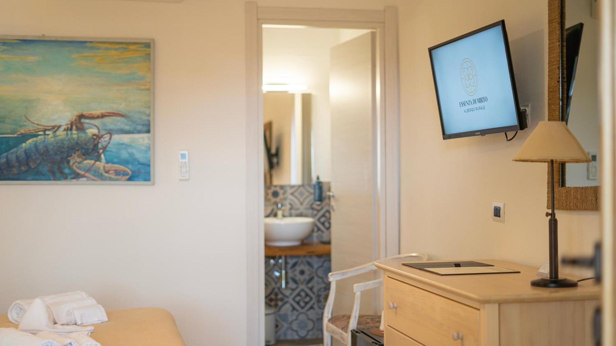 Hotel Essenza Di Mirto La Caletta Room photo
